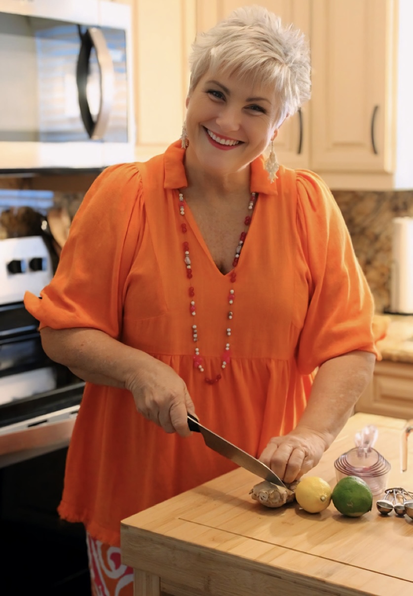 Colleen preparing food in her kitchen